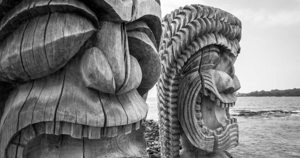 Tiki statues on the beach